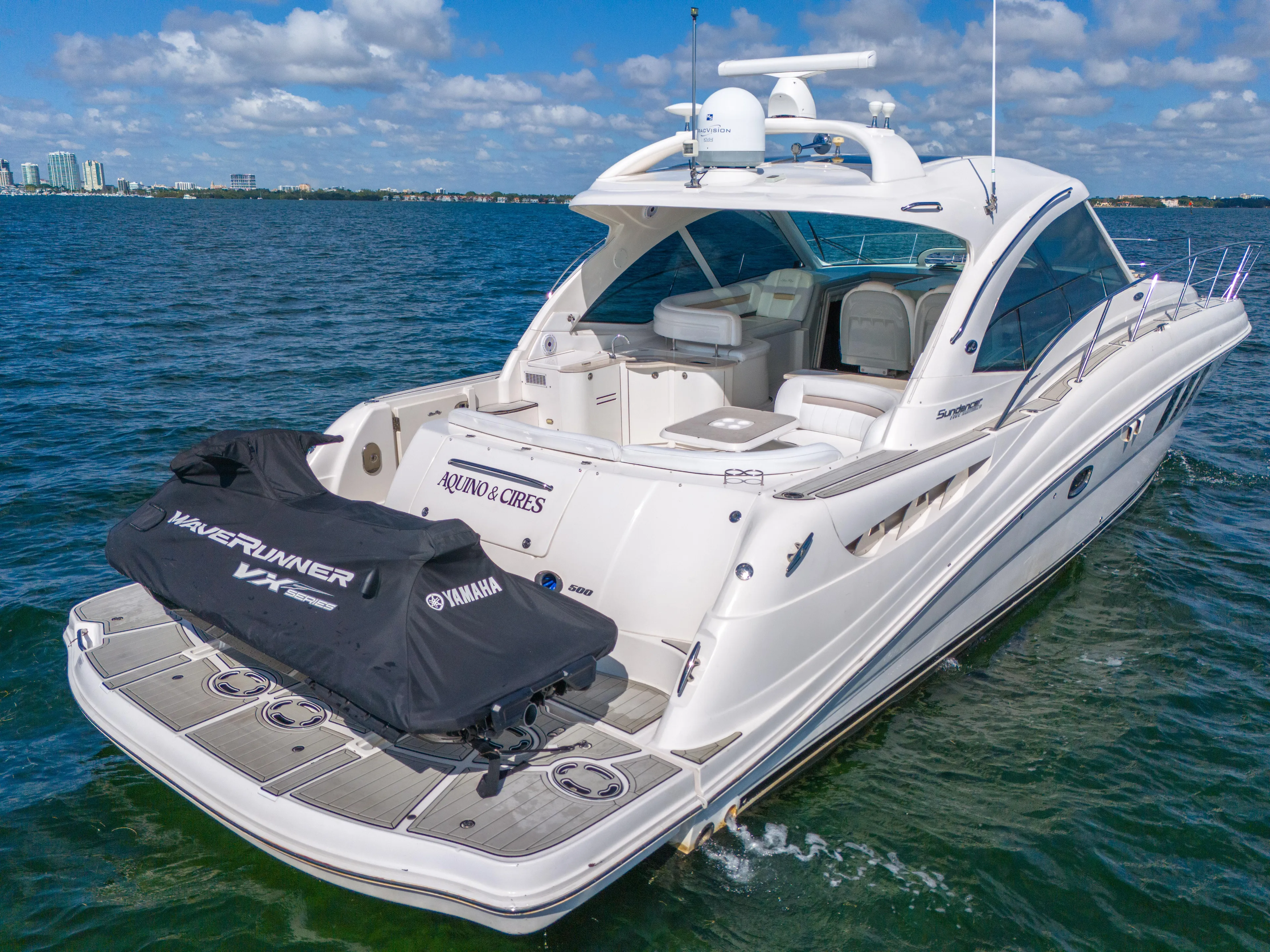  Yacht Photos Pics Sea Ray 500 Sundancer 2010 yacht with Yamaha WaveRunner on deck, cruising in open water.