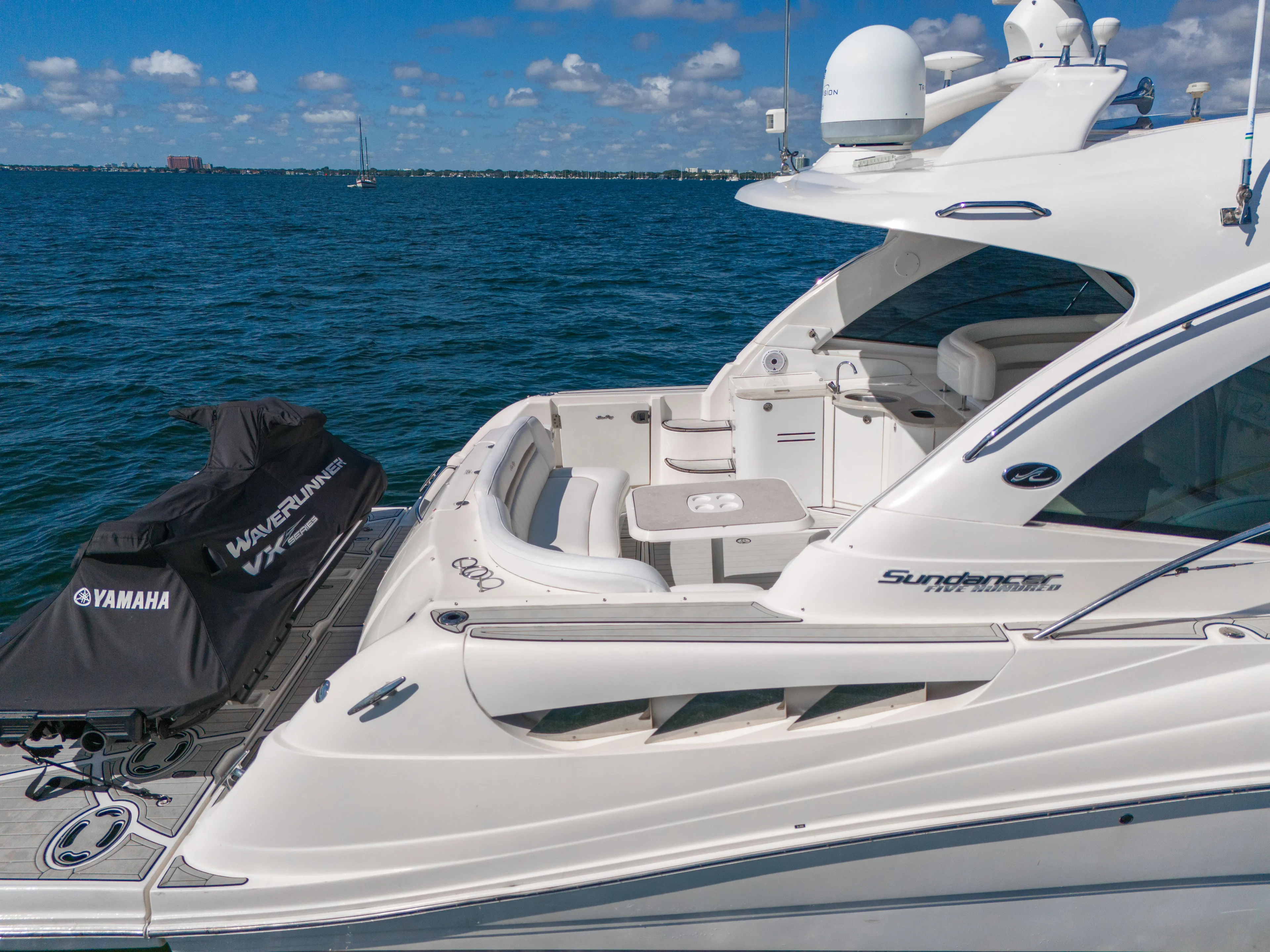  Yacht Photos Pics Sea Ray 500 Sundancer 2010 yacht on blue ocean with Yamaha WaveRunner.