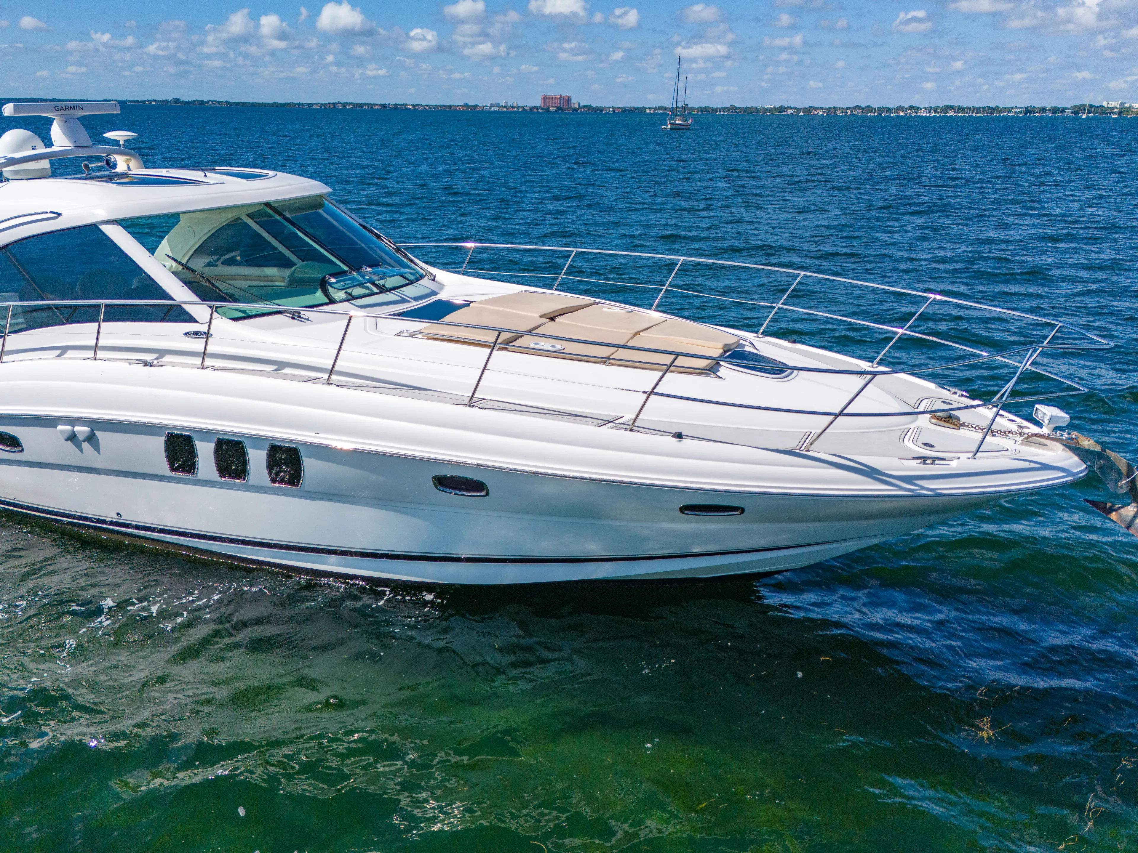  Yacht Photos Pics 2010 Sea Ray 500 Sundancer yacht cruising on clear blue water.