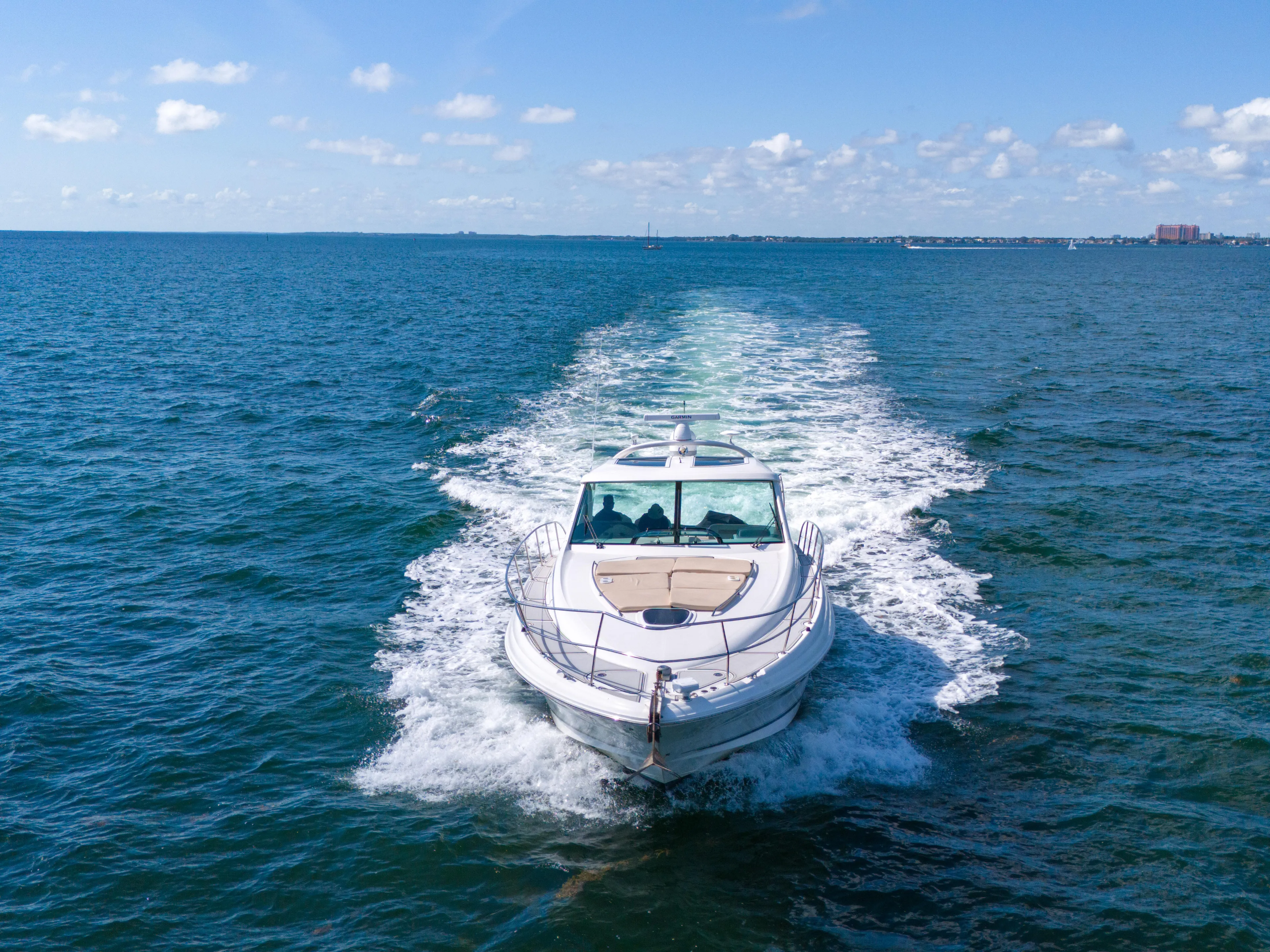  Yacht Photos Pics 2010 Sea Ray 500 Sundancer cruising on open water under a clear blue sky.