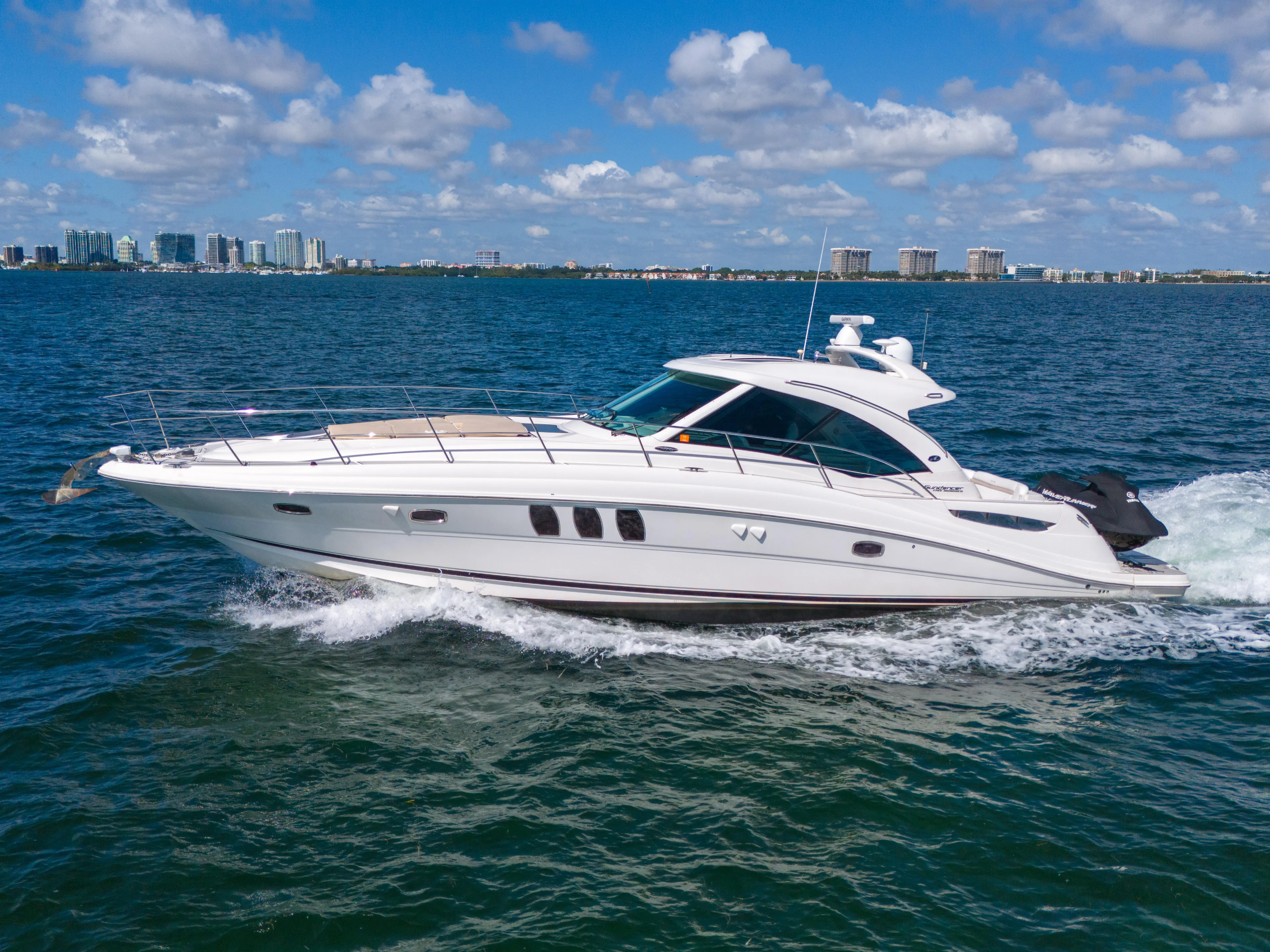  Yacht Photos Pics 2010 Sea Ray 500 Sundancer cruising on open water under a clear blue sky.