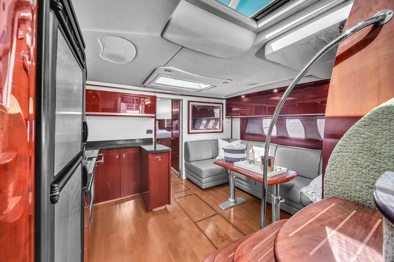  Yacht Photos Pics Luxurious interior of 2010 Sea Ray 500 Sundancer yacht with modern kitchen and dining area.