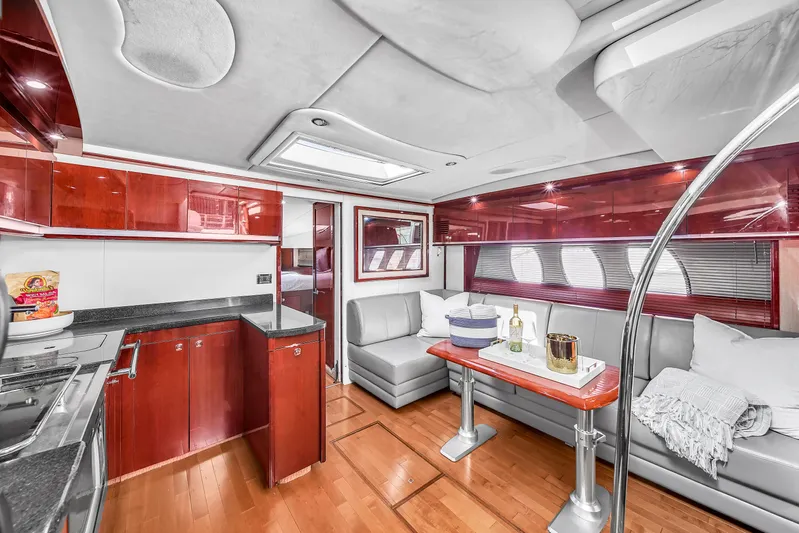  Yacht Photos Pics Luxurious interior of 2010 Sea Ray 500 Sundancer yacht with modern kitchen and seating area.