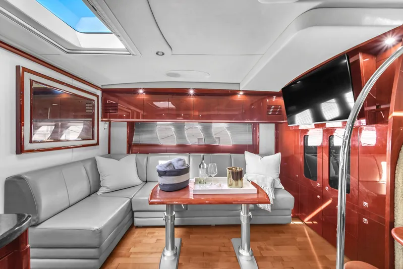  Yacht Photos Pics Luxurious interior of 2010 Sea Ray 500 Sundancer yacht with elegant seating and modern amenities.