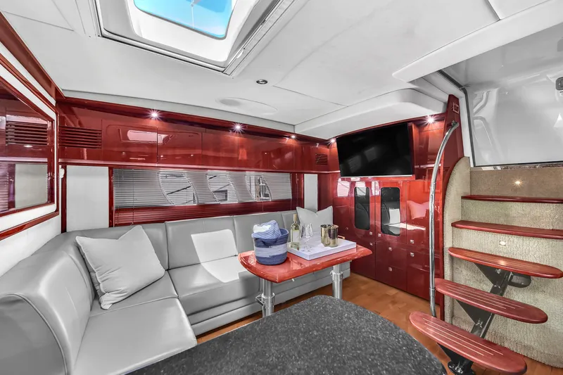  Yacht Photos Pics Luxurious interior of 2010 Sea Ray 500 Sundancer yacht with modern seating and elegant wood finishes.