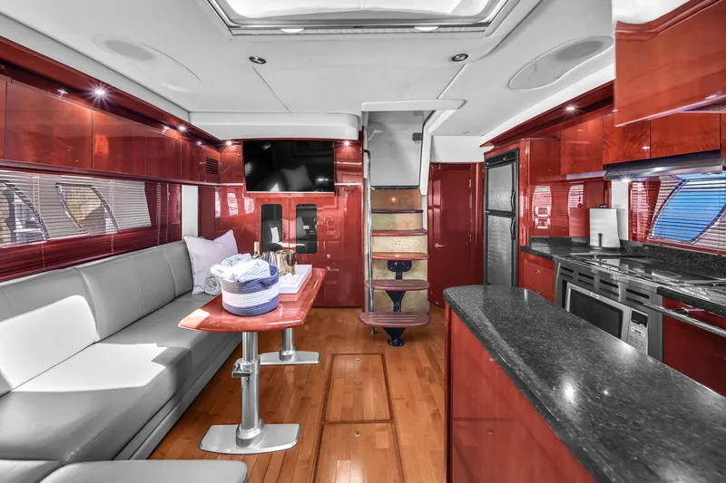  Yacht Photos Pics Luxurious interior of 2010 Sea Ray 500 Sundancer yacht with modern kitchen and seating area.