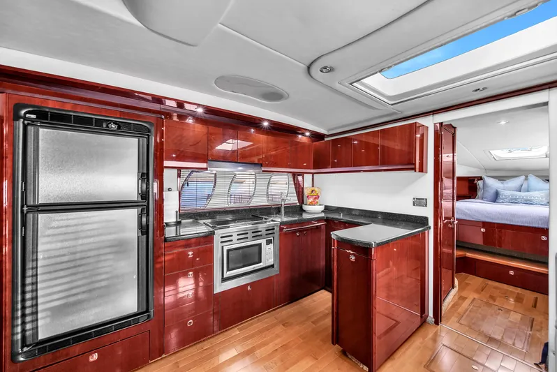  Yacht Photos Pics Luxurious kitchen interior of 2010 Sea Ray 500 Sundancer yacht with modern appliances.