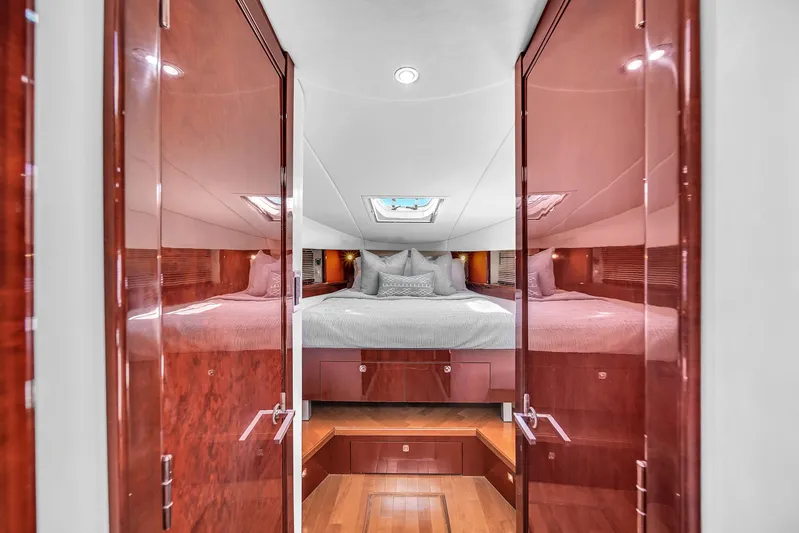  Yacht Photos Pics Luxurious cabin interior of 2010 Sea Ray 500 Sundancer yacht with elegant wood finishes.