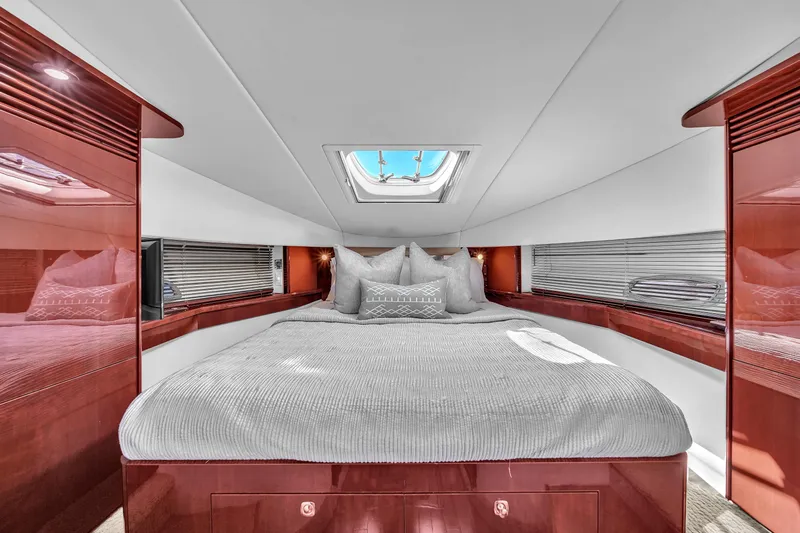  Yacht Photos Pics Luxurious cabin interior of 2010 Sea Ray 500 Sundancer yacht with skylight and plush bedding.