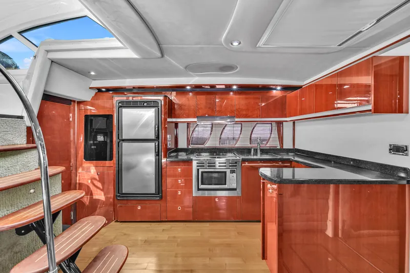  Yacht Photos Pics Luxurious kitchen interior of 2010 Sea Ray 500 Sundancer yacht with modern appliances.