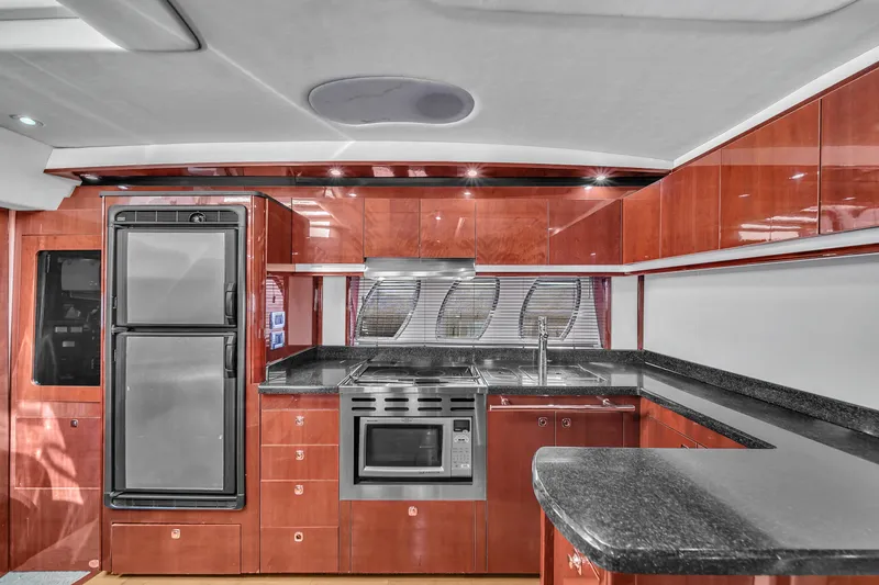  Yacht Photos Pics Luxurious kitchen interior of 2010 Sea Ray 500 Sundancer yacht with modern appliances.