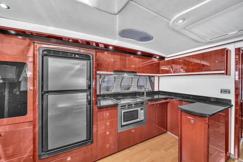  Yacht Photos Pics Luxurious kitchen interior of 2010 Sea Ray 500 Sundancer yacht with modern appliances.