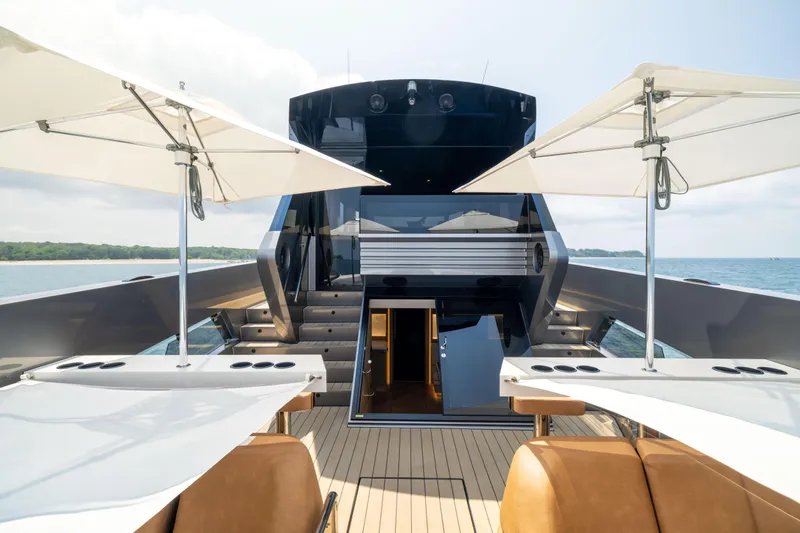 Grit Yacht Photos Pics Luxurious 2025 Steeler Bronson 67 Beachclub yacht deck with umbrellas and seating.