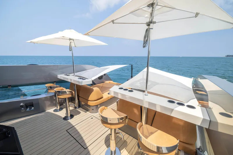 Grit Yacht Photos Pics Luxurious 2025 Steeler Bronson 67 Beachclub yacht deck with bar and ocean view.