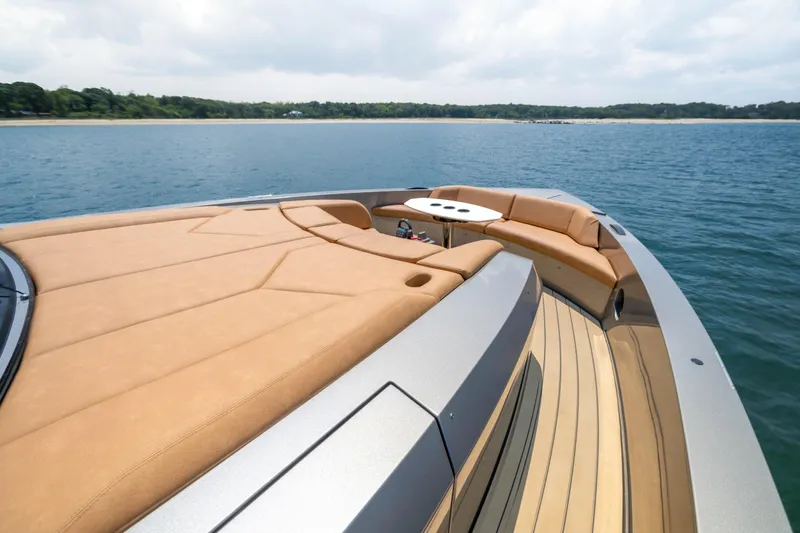 Grit Yacht Photos Pics Luxurious 2025 Steeler Bronson 67 Beachclub yacht with elegant deck and seating area.