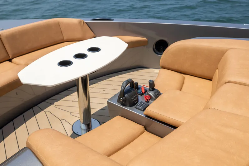 Grit Yacht Photos Pics Luxurious seating area on 2025 Steeler Bronson 67 Beachclub yacht with control panel.