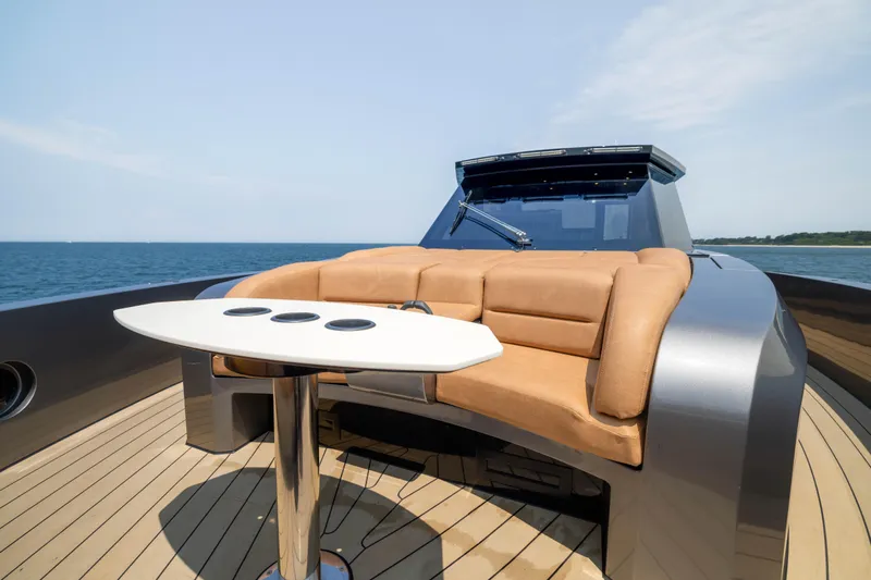 Grit Yacht Photos Pics Luxurious 2025 Steeler Bronson 67 Beachclub yacht with elegant seating and ocean view.