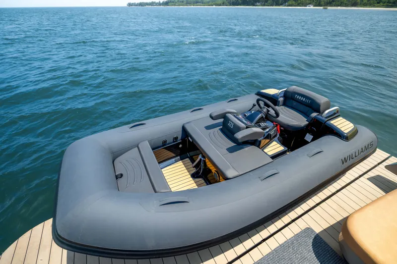 Grit Yacht Photos Pics Inflatable boat docked on water, featuring Williams Turbojet branding.