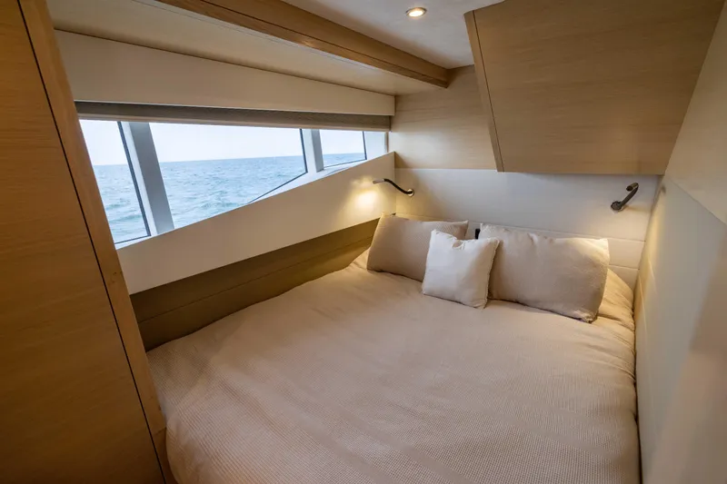 Grit Yacht Photos Pics Luxurious bedroom interior of 2025 Steeler Bronson 67 Beachclub yacht with ocean view.