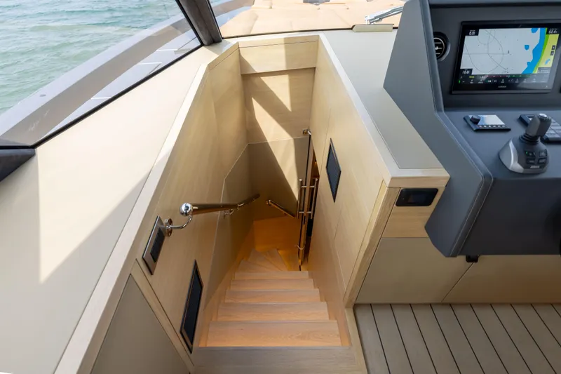 Grit Yacht Photos Pics Staircase and control panel on 2025 Steeler Bronson 67 Beachclub yacht interior.