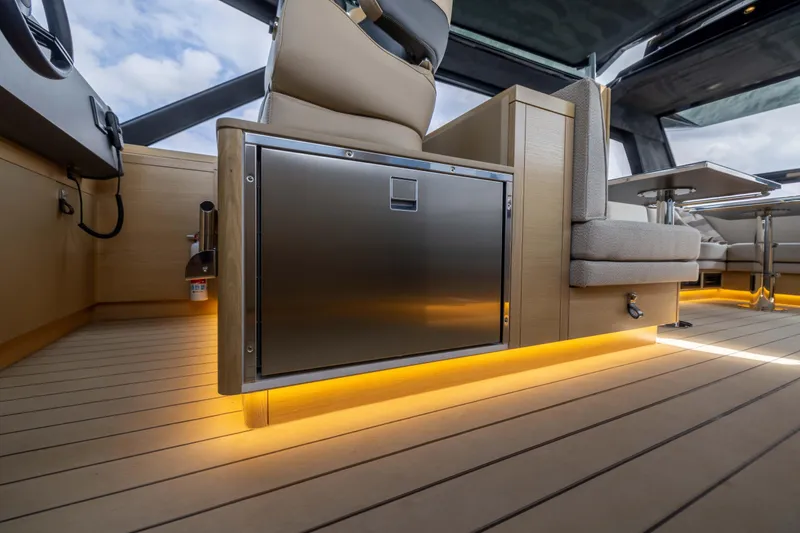 Grit Yacht Photos Pics Luxurious interior of 2025 Steeler Bronson 67 Beachclub yacht with modern seating and ambient lighting.