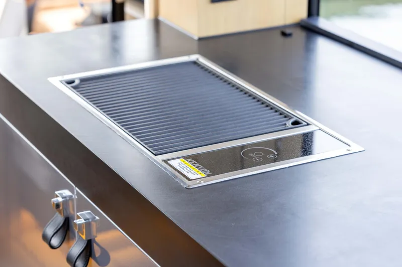 Grit Yacht Photos Pics Modern grill on Steeler Bronson 67 Beachclub yacht, 2025 model, sleek countertop design.