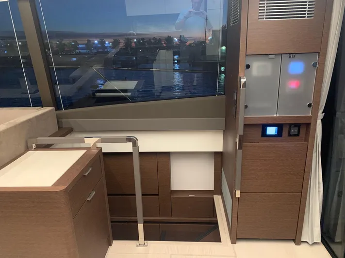  Yacht Photos Pics Interior of 2021 Prestige 590 Sport Fly yacht, featuring modern cabinetry and sleek design.