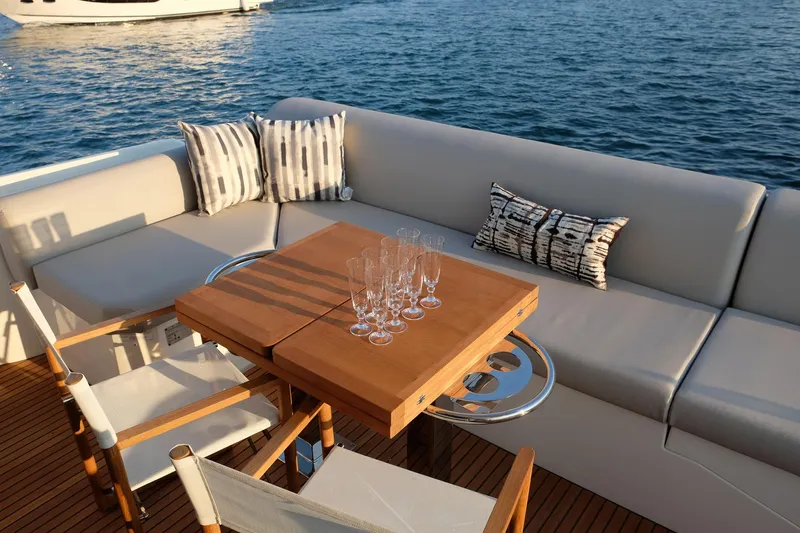  Yacht Photos Pics Luxurious seating area on 2021 Prestige 590 Sport Fly yacht with ocean view.