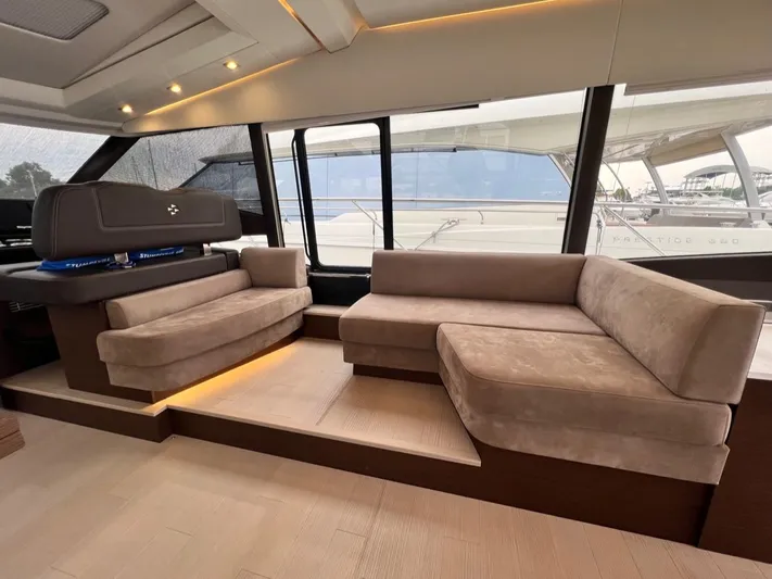 Yacht Photos Pics Luxurious interior of 2021 Prestige 590 Sport Fly yacht with plush seating and modern design.