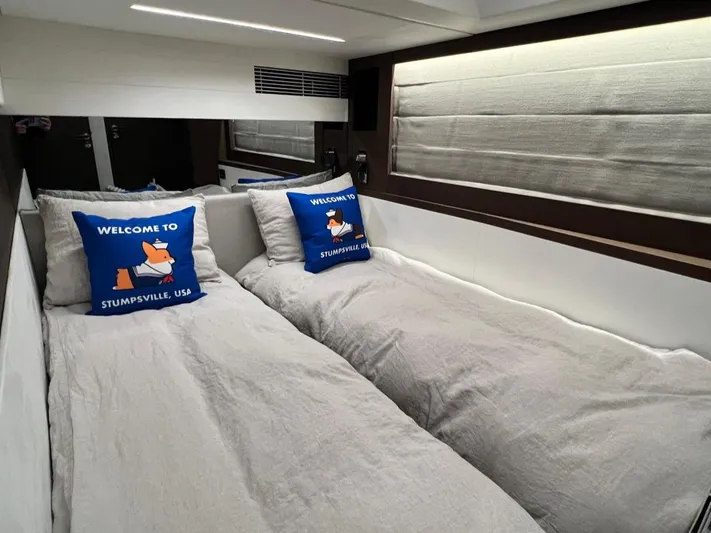  Yacht Photos Pics Twin beds in a 2021 Prestige 590 Sport Fly yacht cabin with decorative pillows.