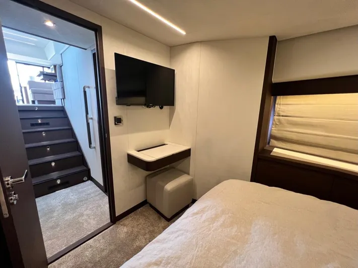  Yacht Photos Pics Luxurious cabin interior of 2021 Prestige 590 Sport Fly yacht with modern amenities.