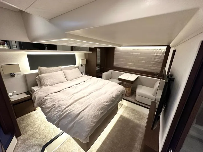  Yacht Photos Pics Luxurious bedroom interior of 2021 Prestige 590 Sport Fly yacht with modern furnishings.