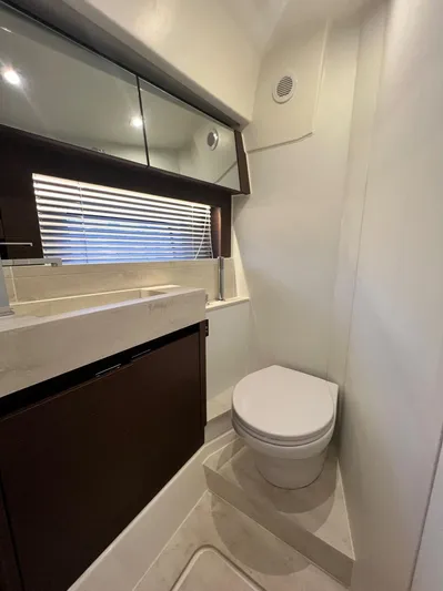  Yacht Photos Pics Modern bathroom interior on 2021 Prestige 590 Sport Fly yacht.