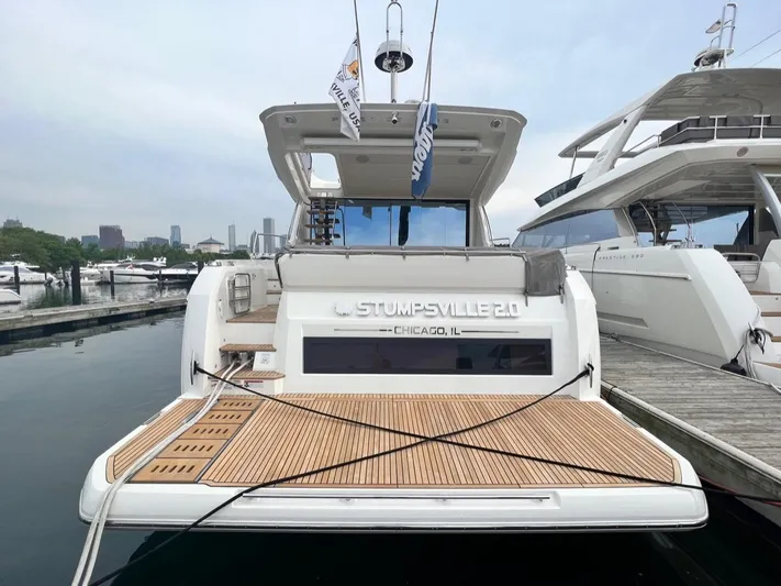  Yacht Photos Pics 2021 Prestige 590 Sport Fly yacht docked in Chicago marina.