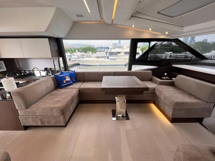  Yacht Photos Pics Luxurious interior of 2021 Prestige 590 Sport Fly yacht with plush seating and modern design.