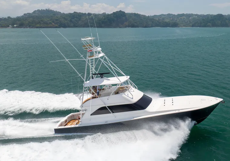 Relentless Yacht Photos Pics 2003 Viking 61 Convertible yacht cruising on open water.