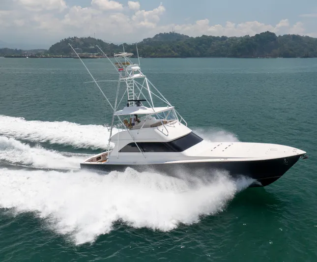 Relentless Yacht Photos Pics 2003 Viking 61 Convertible yacht cruising on open water, creating a dynamic wake.