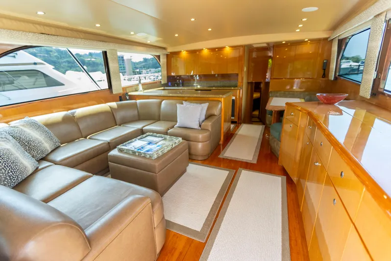 Relentless Yacht Photos Pics Luxurious interior of a 2003 Viking 61 Convertible yacht with leather seating and wood finishes.