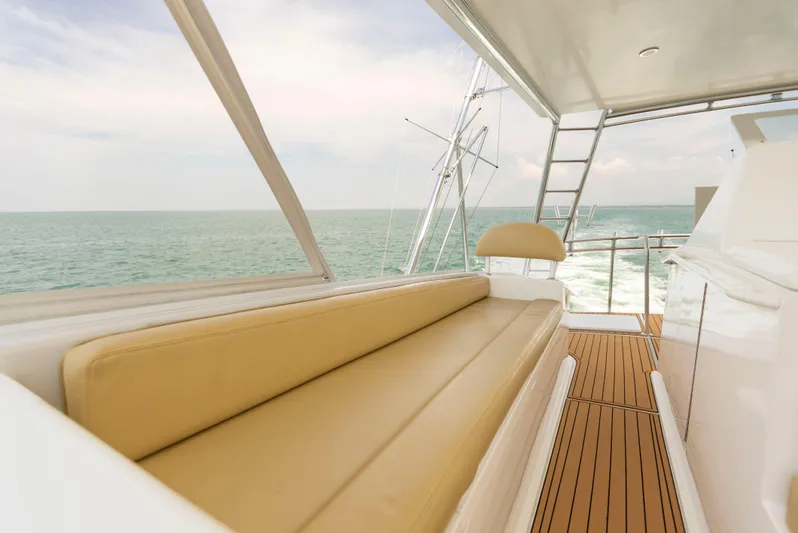 Relentless Yacht Photos Pics Luxurious 2003 Viking 61 Convertible yacht interior with ocean view and comfortable seating.