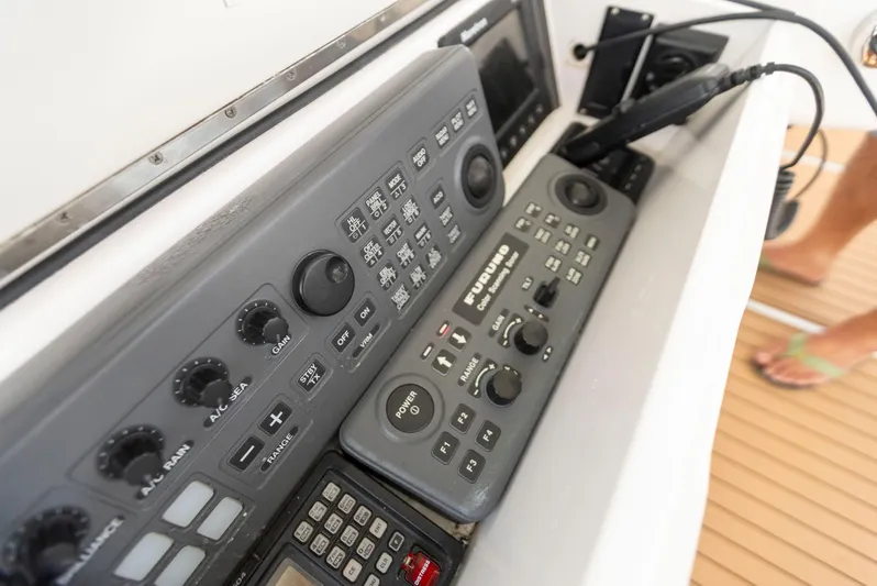 Relentless Yacht Photos Pics Control panel of a 2003 Viking 61 Convertible yacht, featuring navigation and communication equipment.