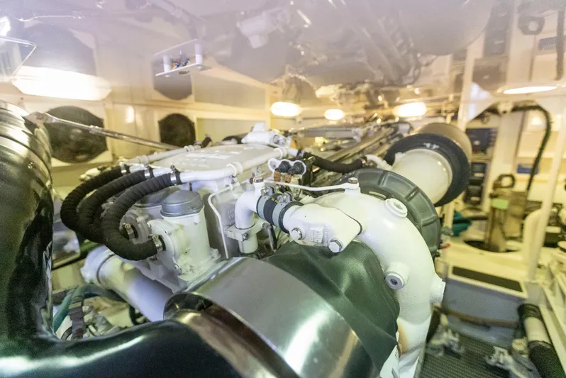 Relentless Yacht Photos Pics Engine room of a 2003 Viking 61 Convertible yacht, showcasing complex machinery and components.