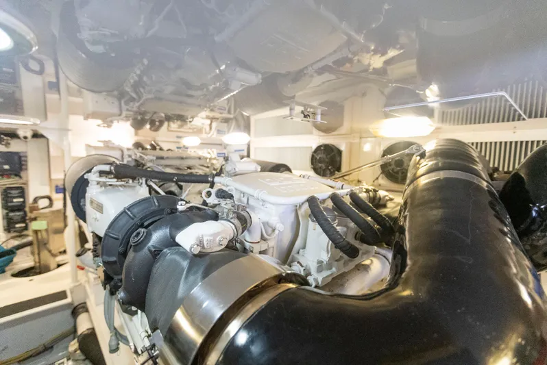 Relentless Yacht Photos Pics Engine room of a 2003 Viking 61 Convertible yacht, showcasing machinery and components.