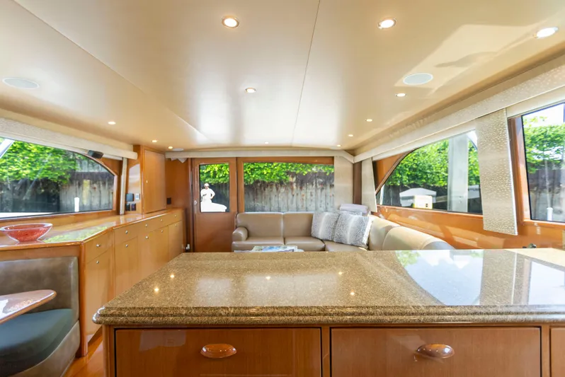 Relentless Yacht Photos Pics Luxurious interior of 2003 Viking 61 Convertible yacht with elegant furnishings and ample natural light.