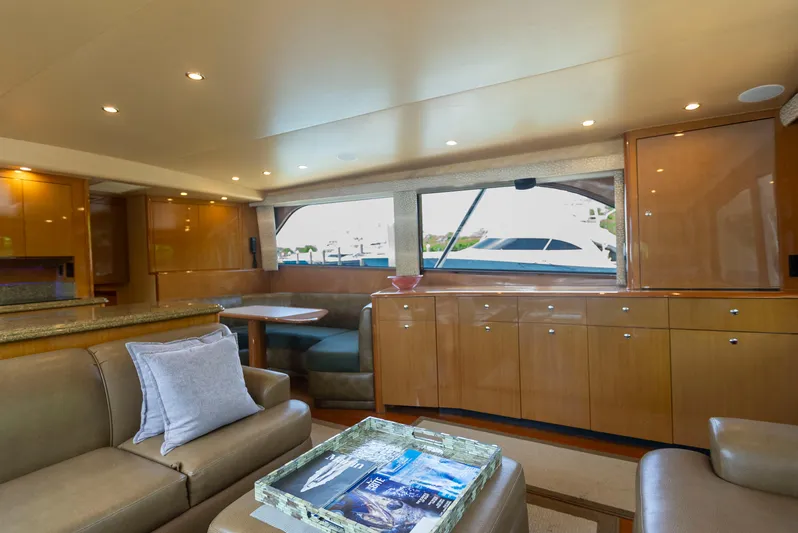 Relentless Yacht Photos Pics Luxurious interior of 2003 Viking 61 Convertible yacht with elegant wood finishes and comfortable seating.