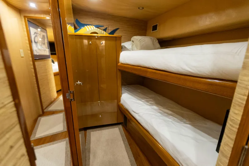 Relentless Yacht Photos Pics Bunk beds in 2003 Viking 61 Convertible yacht cabin with wooden interior.