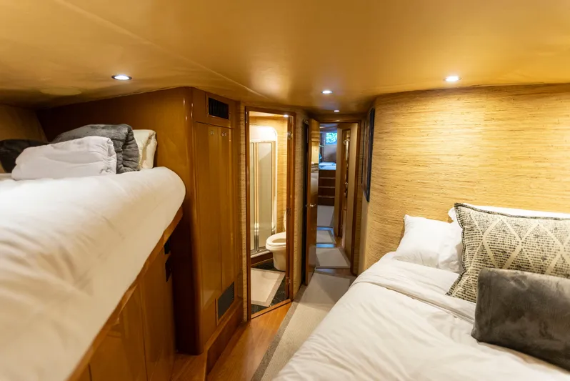 Relentless Yacht Photos Pics Interior of 2003 Viking 61 Convertible yacht with cozy sleeping quarters and modern amenities.