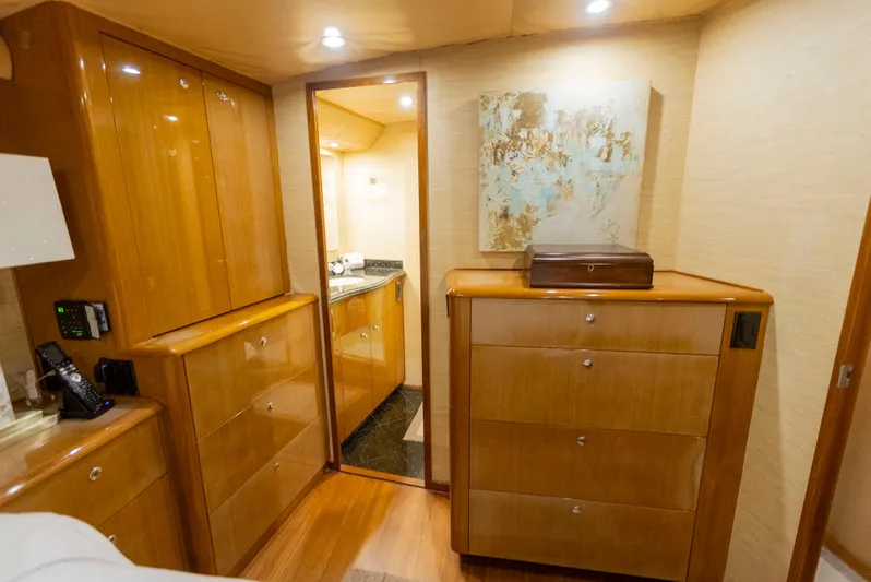 Relentless Yacht Photos Pics Luxurious interior of a 2003 Viking 61 Convertible yacht with wooden cabinetry and modern decor.