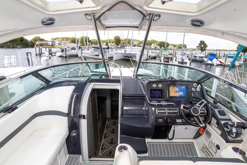 Rum Punch It Yacht Photos Pics 2018 Formula 37 Performance Cruiser cockpit with modern navigation system and luxurious seating.