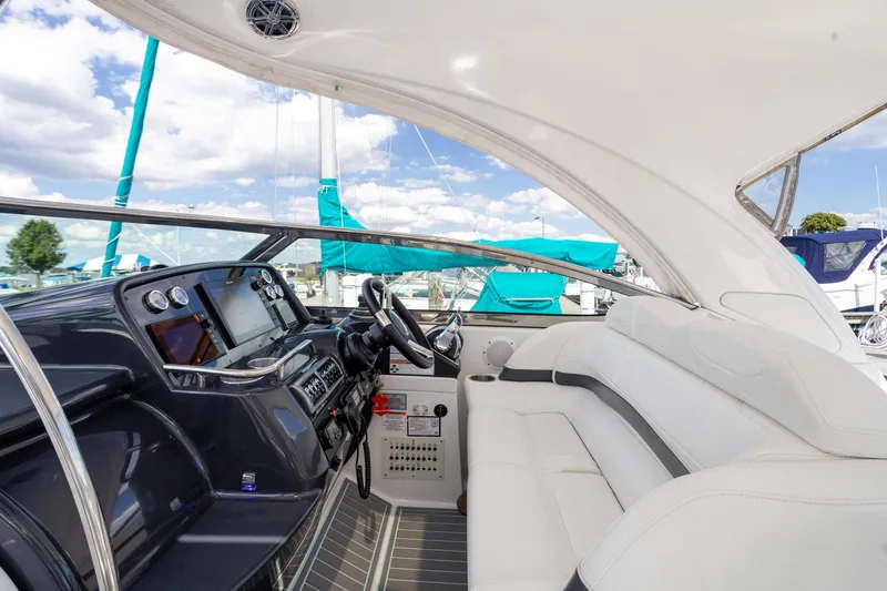 Rum Punch It Yacht Photos Pics 2018 Formula 37 Performance Cruiser cockpit with white seating and modern dashboard.