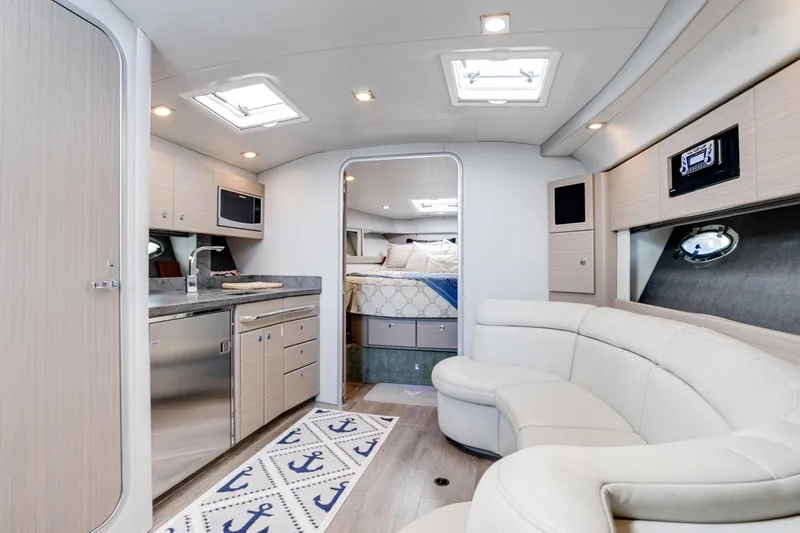 Rum Punch It Yacht Photos Pics Luxurious interior of 2018 Formula 37 Performance Cruiser with modern kitchen and cozy seating.
